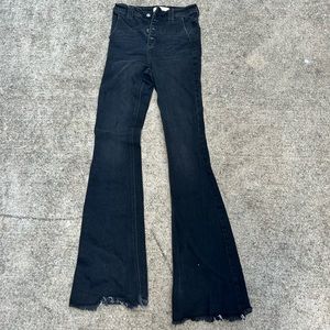 Long boot cut black jeans! Super cute with boots!